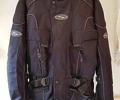 Large RK Sports winter motorbike jacket.