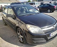 Black hatchback Opel Astra