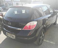 Black hatchback Opel Astra