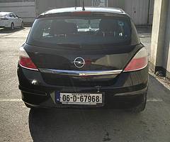 Black hatchback Opel Astra