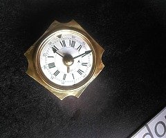 Small brass alarm clock