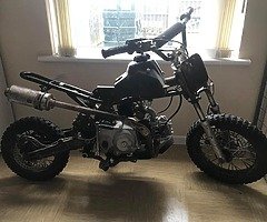 Two 110cc stomps, plastics, 2 bike trailer