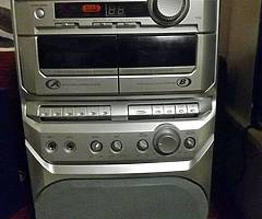 Karaoke CD and Cassette player with Amplifier and Microphone hubs for parties.