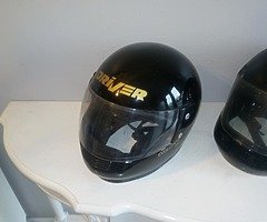 TWO USED MOTORCYCLE HELMETS