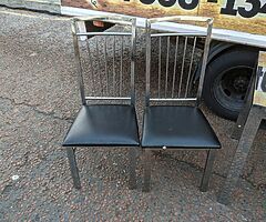 Black glass znd chrime dining room table and 4 chairs £125