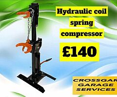 Hydraulic coil spring compressor