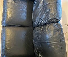 2 black leather sofas