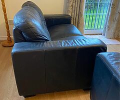 2 black leather sofas