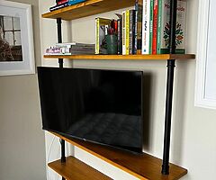 Shelving unit with with wooden shelves and industrial piping. - Image 5/5