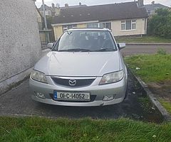 I'm selling 01 Mazda 323 running perfect has all good tires like new have no nct or tax but and ps