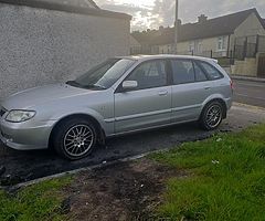 I'm selling 01 Mazda 323 running perfect has all good tires like new have no nct or tax but and ps - Image 3/4