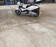 Honda fes 125